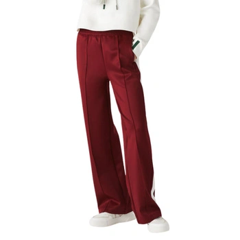 Spodnie damskie Lacoste dresowe z lampasami bordowe r. XS